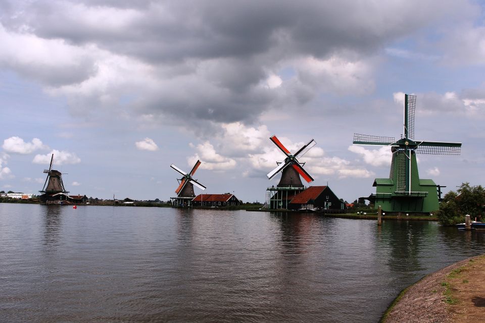 From Amsterdam: Windmills & Volendam Private Tour - Walking Zaanse Schans: mills, wooden houses, and shops without the chaos