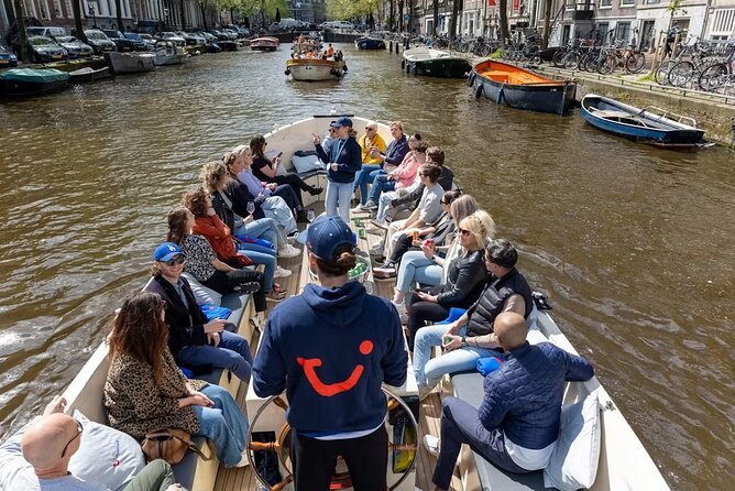 Highlights and Local Insights Canal Cruise Tour in Amsterdam - Red Light District Pass-By: Neon Sights With Local Context