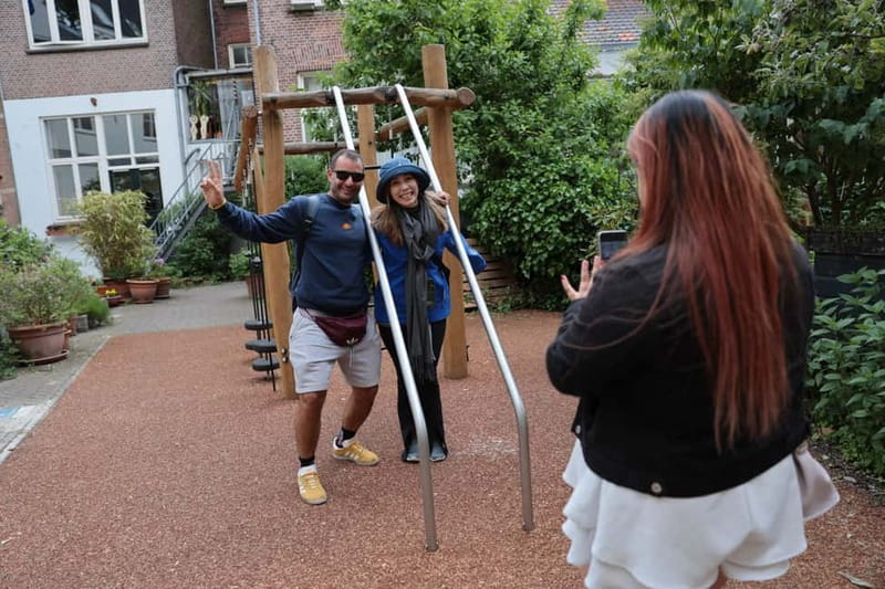 Liberal Amsterdam: Small-Group Walking Tour & Anne Frank VR - Bridges, secret spaces under water, and why houses lean