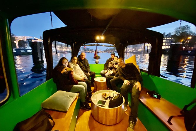 Light Event Amsterdam by small boat, 8 passengers max! You won't find any better - Amsterdam Light Festival, but from a heated boat