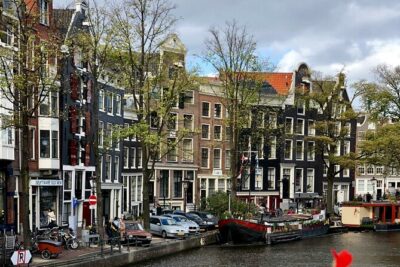 Personalized Hidden Gems of Amsterdam Private Tour with a Local - St. Nicholas Basilica, Dancing Houses, and the Beguines Lesson