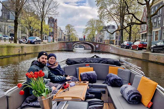 Private 90 Minute Amsterdam Canal Belt Exploration Cruise - Munt Tower and the feeling of canal-city scale
