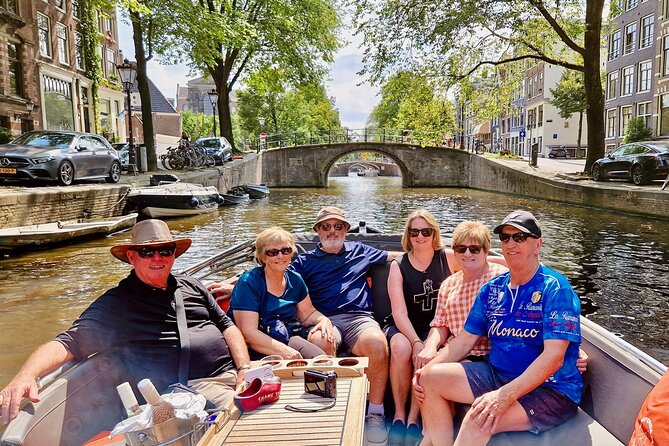 Private 90 Minute Amsterdam Canal Belt Exploration Cruise - Amstel River start: dancing houses and leaning-building lore