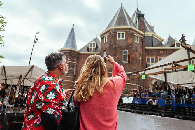 Private City Kickstart Tour: Amsterdam - Bloemenmarkt and Begijnhof: flowers and medieval calm in the same breath