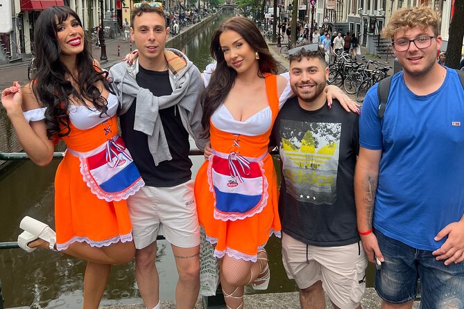 Private Hostess Bar Tour in Amsterdam Red Light District (3h) - De Wallen: four bars, free shots, dance shows, and drinking games