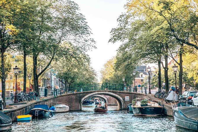 Private Romantic Canal Cruise Amsterdam with Bubbly and Snacks - Skinny Bridge and the smallest house: romance rituals with real local flavor