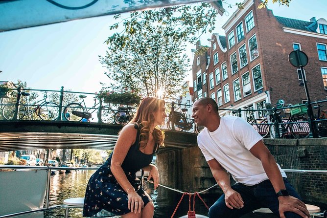 Private Romantic Canal Cruise Amsterdam with Bubbly and Snacks - Boat comfort details: heated seats, retractable roof, and included blankets