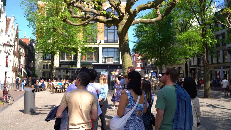 Skipping Lines & Sipping Beers: A History Tour of Amsterdam - Ferry Ride to North Amsterdam Near Central Station