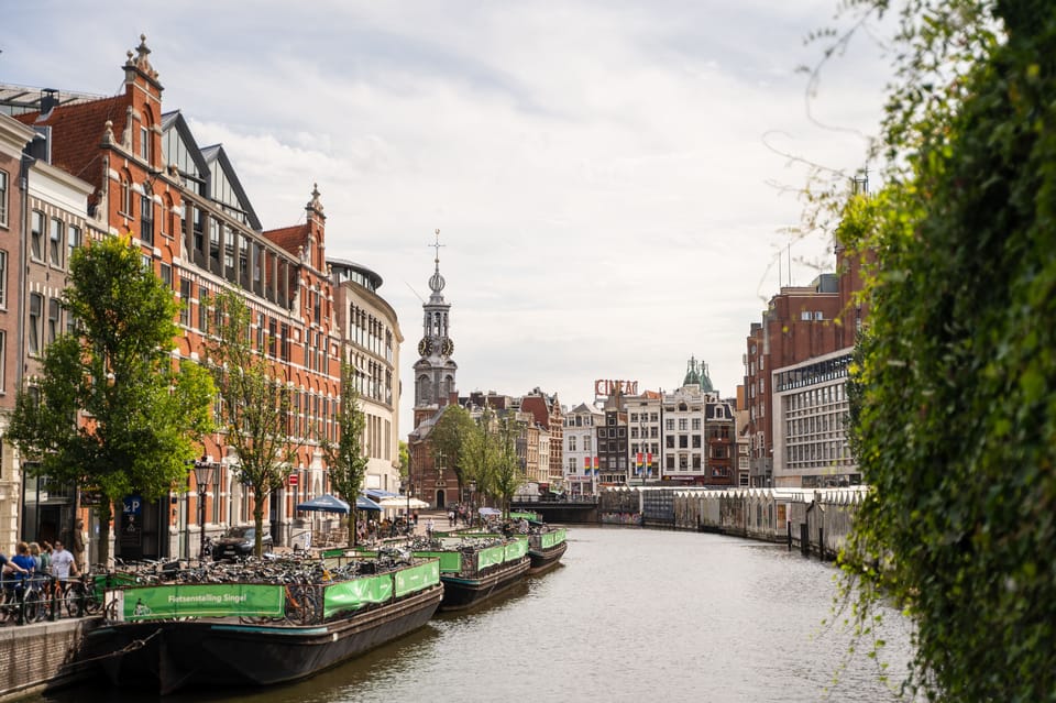 Small-Group Walking Tour with Amsterdam Canal Cruise - The Canal Cruise Switch: From Walking to the Water Line