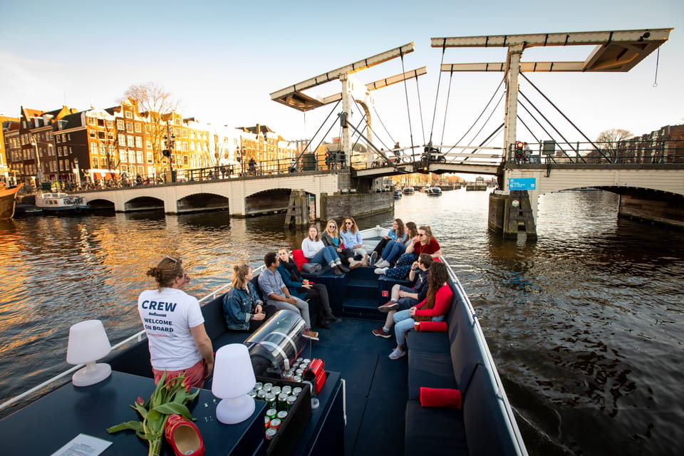 Small-Group Walking Tour with Amsterdam Canal Cruise - 1-Hour Canal Cruise Options: Audio vs. Luxury Open Boat