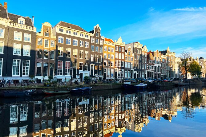 Walking Tour about Golden Age Architecture, private local guide - Ronde Lutherse Kerk to Prinsengracht warehouses: religion, shipping, and hoisting beams